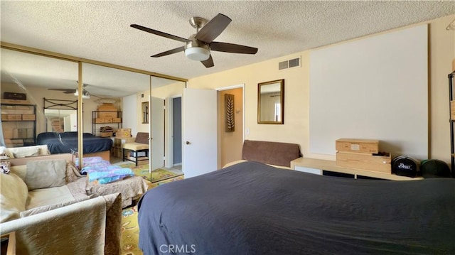 8601 Burnet Ave Unit D, North Hills, CA 91343 - bedroom featuring a textured ceiling, a ceiling fan, and a closet
