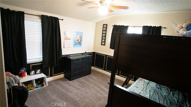 6384 E Lowe Ave, Fresno, CA 93727 - bedroom with lofted ceiling, carpet floors, a textured ceiling, wainscoting, and ceiling fan