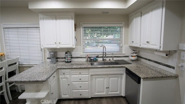 6384 E Lowe Ave, Fresno, CA 93727 - kitchen with stainless steel dishwasher, a sink, white cabinetry, and decorative backsplash