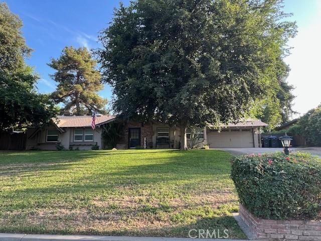 6384 E Lowe Ave, Fresno, CA 93727 - view of front of property with a front yard, an attached garage, and asphalt driveway