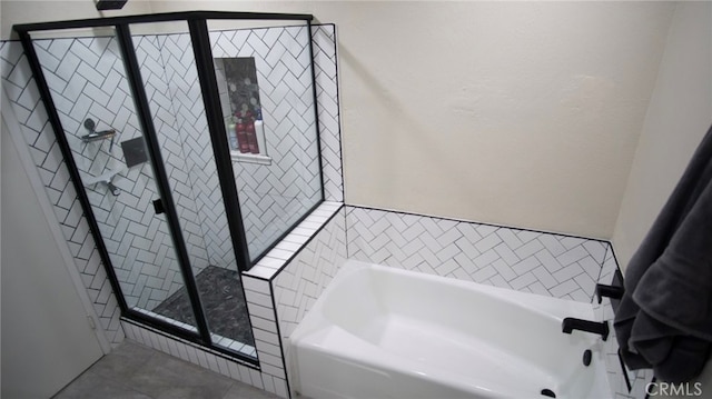 6384 E Lowe Ave, Fresno, CA 93727 - bathroom with a bath, a stall shower, and tile patterned flooring