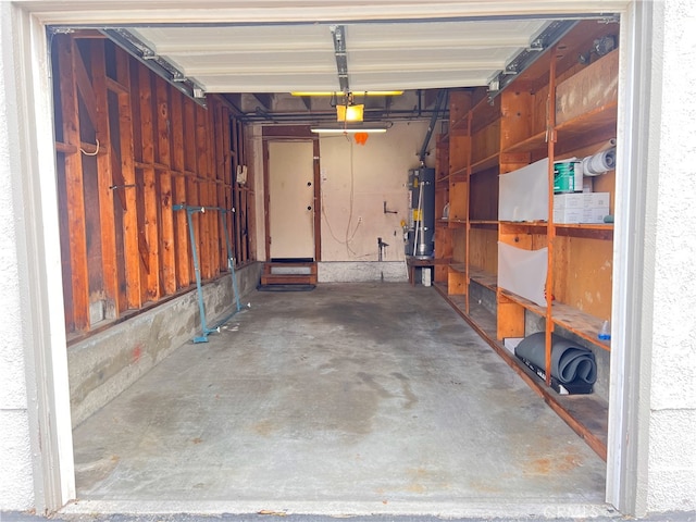 3751 Ketch Ave Unit D, Oxnard, CA 93035 - garage with water heater and a garage door opener