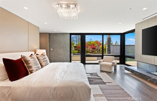 15 Torrey Pines Ln, Newport Beach, CA 92660 - bedroom featuring wood finished floors, multiple windows, a wall of windows, recessed lighting, and access to outside