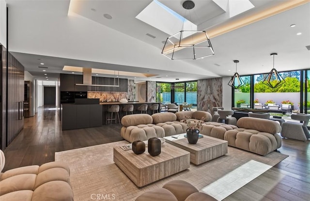 15 Torrey Pines Ln, Newport Beach, CA 92660 - living area with dark wood-style flooring, a skylight, and recessed lighting