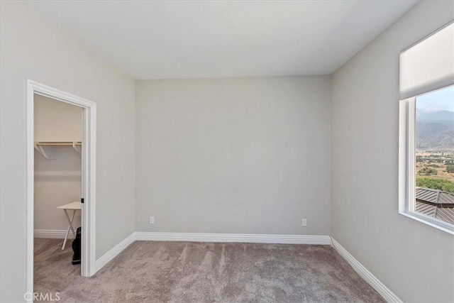 11313 Atlas Ct, Corona, CA 92883 - unfurnished bedroom featuring light carpet and a walk in closet