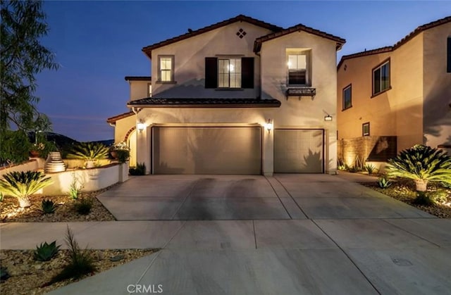 11313 Atlas Ct, Corona, CA 92883 - mediterranean / spanish-style house with a garage, stucco siding, concrete driveway, and a tile roof
