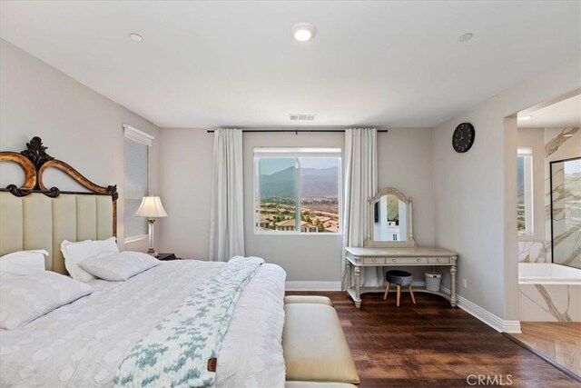 11313 Atlas Ct, Corona, CA 92883 - bedroom with multiple windows, wood finished floors, and recessed lighting