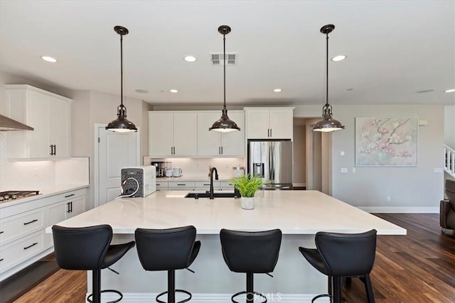 11313 Atlas Ct, Corona, CA 92883 - kitchen featuring stainless steel appliances, backsplash, white cabinets, dark wood-style flooring, and recessed lighting