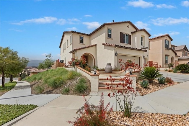 11313 Atlas Ct, Corona, CA 92883 - mediterranean / spanish house with an attached garage, stucco siding, concrete driveway, and a tile roof
