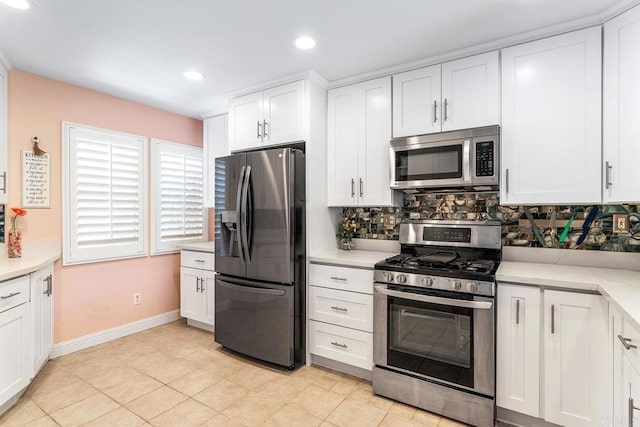 4610 Los Alamos Way Unit C, Oceanside, CA 92057 - kitchen with appliances with stainless steel finishes, decorative backsplash, light countertops, baseboards, and recessed lighting