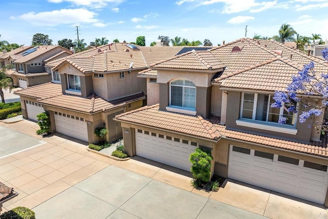 4610 Los Alamos Way Unit C, Oceanside, CA 92057 - view of front of property featuring concrete driveway, a garage, and stucco siding
