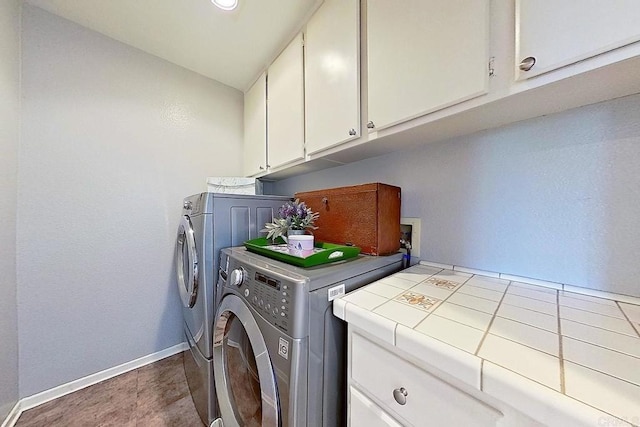 4610 Los Alamos Way Unit C, Oceanside, CA 92057 - laundry room with washer and clothes dryer, cabinet space, and baseboards