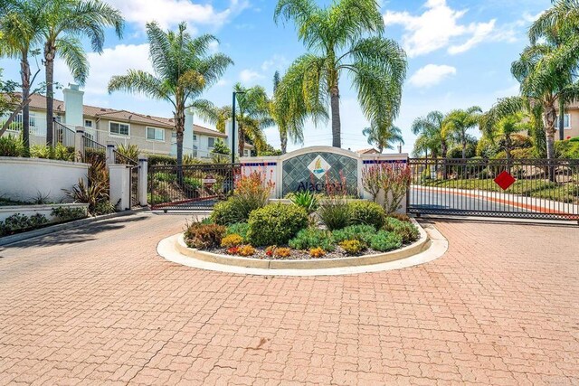 4610 Los Alamos Way Unit C, Oceanside, CA 92057 - community / neighborhood sign with a gate and curved driveway