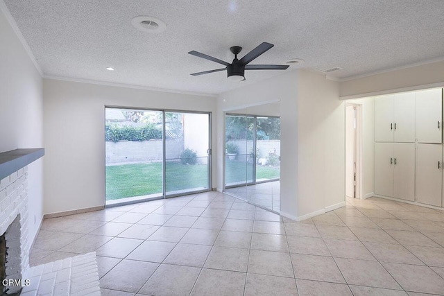 139 Spanner St, Monrovia, CA 91016 - unfurnished room with a ceiling fan, ornamental molding, light tile patterned floors, a textured ceiling, and a brick fireplace