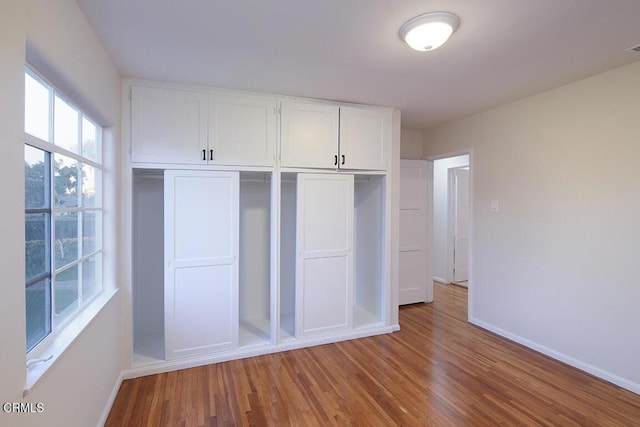 139 Spanner St, Monrovia, CA 91016 - unfurnished bedroom with baseboards, wood finished floors, and a closet