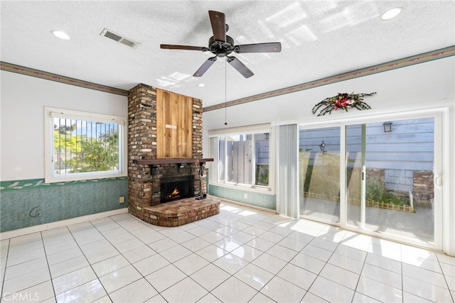 344 E Reed St, Covina, CA 91723 - unfurnished living room with a brick fireplace, ceiling fan, light tile patterned floors, recessed lighting, and a textured ceiling