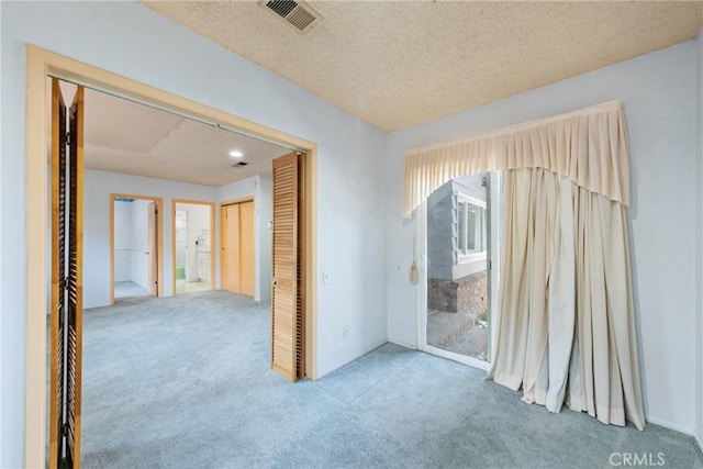 344 E Reed St, Covina, CA 91723 - carpeted empty room with a textured ceiling