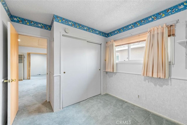344 E Reed St, Covina, CA 91723 - unfurnished bedroom with carpet, a textured ceiling, and a closet