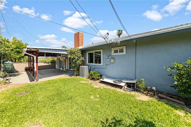 344 E Reed St, Covina, CA 91723 - back of property featuring central air condition unit, a chimney, stucco siding, and a patio area