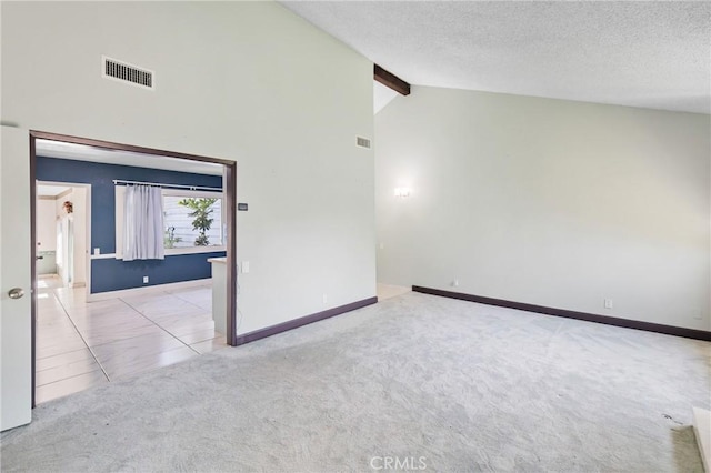 344 E Reed St, Covina, CA 91723 - spare room with carpet, beamed ceiling, baseboards, high vaulted ceiling, and a textured ceiling
