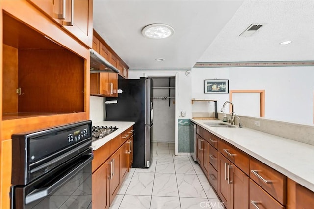 344 E Reed St, Covina, CA 91723 - kitchen with appliances with stainless steel finishes, a sink, under cabinet range hood, light marble finish floors, and light countertops