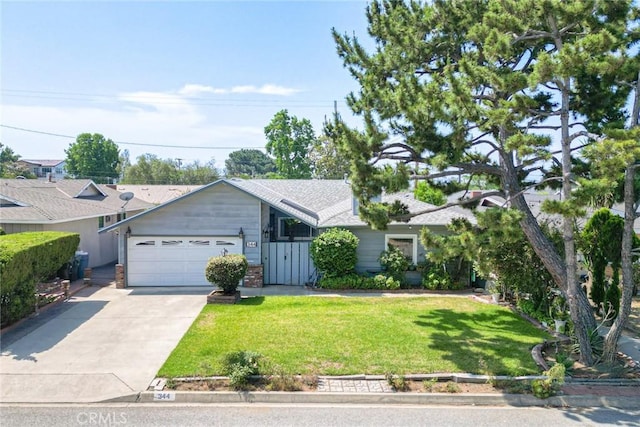 344 E Reed St, Covina, CA 91723 - single story home featuring an attached garage, driveway, a front lawn, and roof with shingles