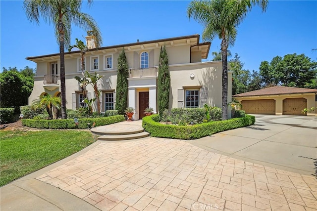 755 Carriage House Dr, Arcadia, CA 91006 - mediterranean / spanish home featuring stucco siding, driveway, and a detached garage