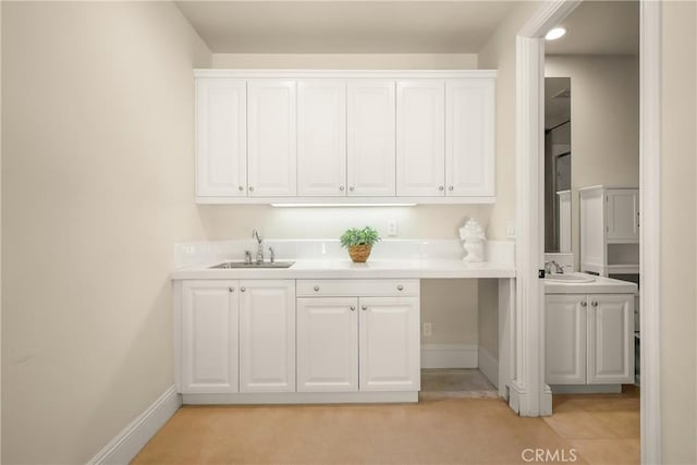 755 Carriage House Dr, Arcadia, CA 91006 - kitchen with a sink, white cabinetry, light countertops, and baseboards