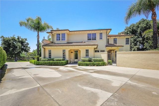 755 Carriage House Dr, Arcadia, CA 91006 - mediterranean / spanish-style house with stucco siding and a gate