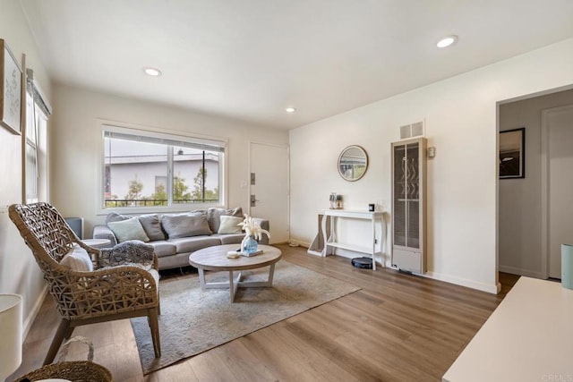102733 3rd St, Encinitas, CA 92024 - living room featuring wood finished floors, a heating unit, baseboards, and recessed lighting