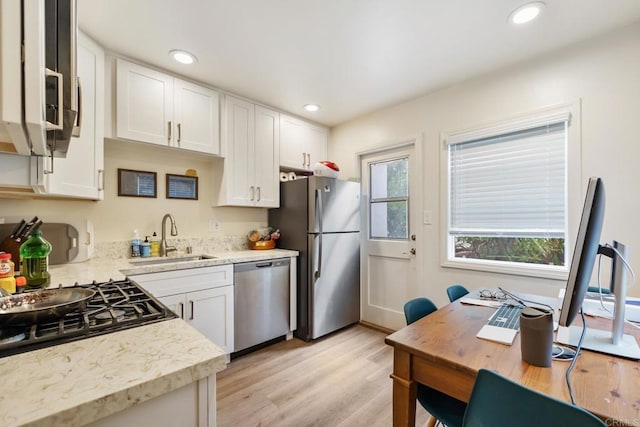 102733 3rd St, Encinitas, CA 92024 - kitchen with stainless steel appliances, a sink, white cabinets, light wood finished floors, and recessed lighting