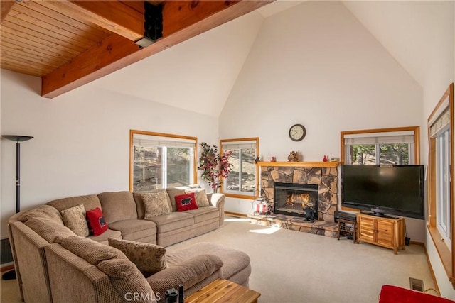 1176 Aleutian Dr, Lake Arrowhead, CA 92352 - carpeted living room featuring a stone fireplace, healthy amount of natural light, high vaulted ceiling, and beam ceiling