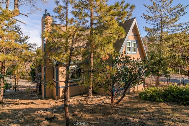 1176 Aleutian Dr, Lake Arrowhead, CA 92352 - view of side of property featuring a chimney and roof with shingles