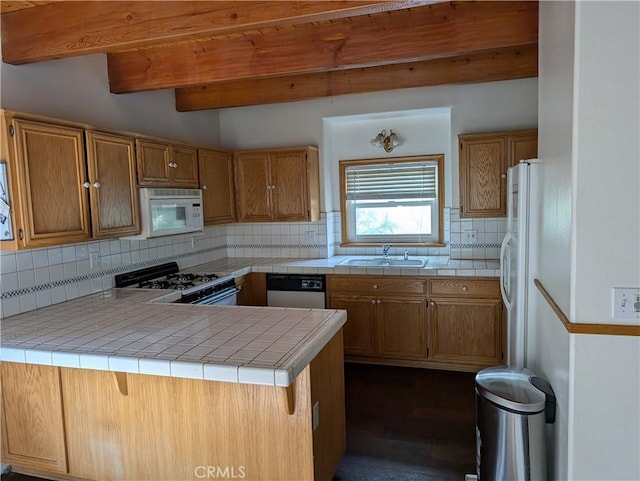 1176 Aleutian Dr, Lake Arrowhead, CA 92352 - kitchen featuring white appliances, a peninsula, backsplash, beamed ceiling, and brown cabinets