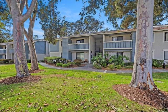 25611 Quail Run Unit 18, Dana Point, CA 92629 - view of front of property with a front lawn and stucco siding