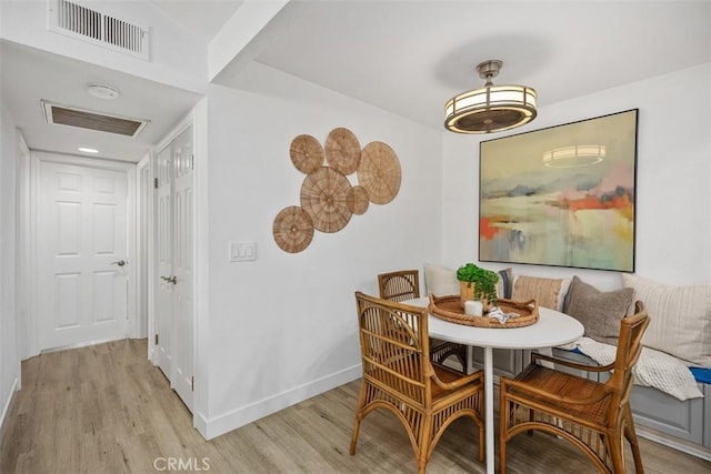 25611 Quail Run Unit 18, Dana Point, CA 92629 - dining room featuring light wood-type flooring, baseboards, and breakfast area
