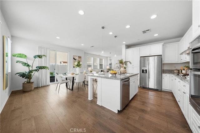 333 Calle Elegante, Lake Forest, CA 92630 - kitchen featuring appliances with stainless steel finishes, a sink, a center island with sink, recessed lighting, and white cabinets