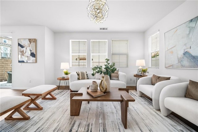 333 Calle Elegante, Lake Forest, CA 92630 - living area with wood finished floors, plenty of natural light, baseboards, and a chandelier