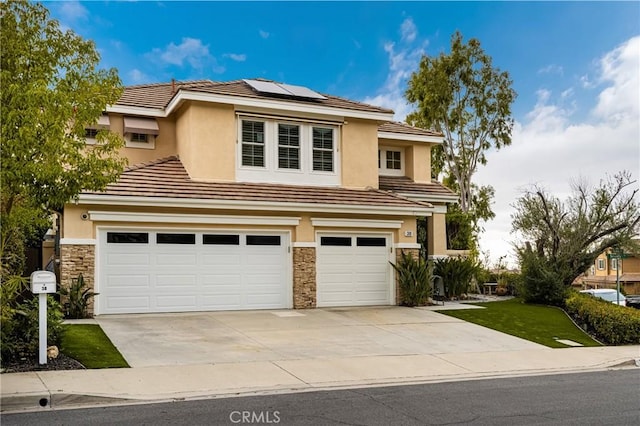 38 Tessera Ave, Lake Forest, CA 92610 - traditional-style home with an attached garage, driveway, stucco siding, and solar panels