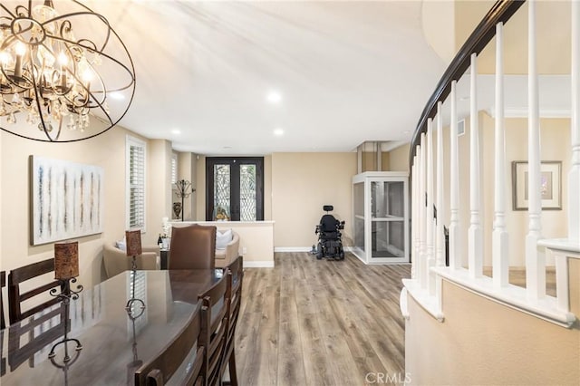 38 Tessera Ave, Lake Forest, CA 92610 - dining room featuring a chandelier, light wood finished floors, recessed lighting, baseboards, and stairway