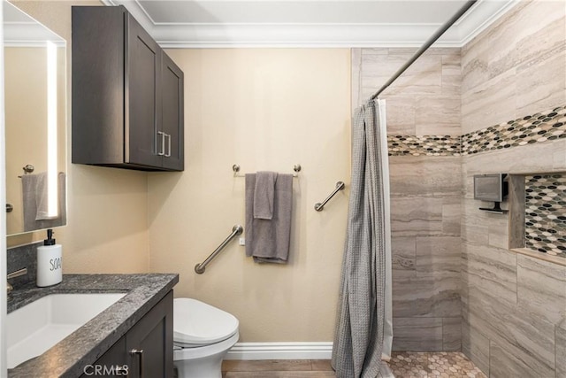 38 Tessera Ave, Lake Forest, CA 92610 - bathroom with toilet, a tile shower, vanity, crown molding, and baseboards