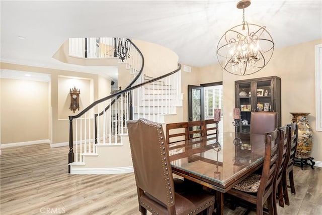 38 Tessera Ave, Lake Forest, CA 92610 - dining room with a chandelier, stairway, wood finished floors, and baseboards
