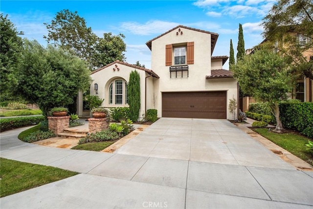 21 Corte Lomas Verdes, San Clemente, CA 92673 - mediterranean / spanish-style home featuring concrete driveway, an attached garage, stucco siding, and a tiled roof