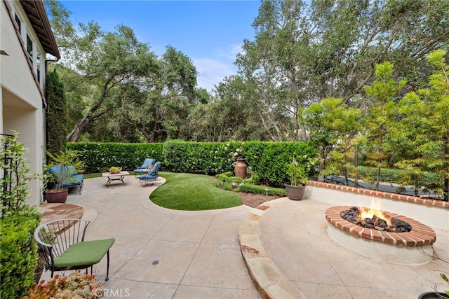 21 Corte Lomas Verdes, San Clemente, CA 92673 - view of patio / terrace featuring a fire pit and view of wooded area