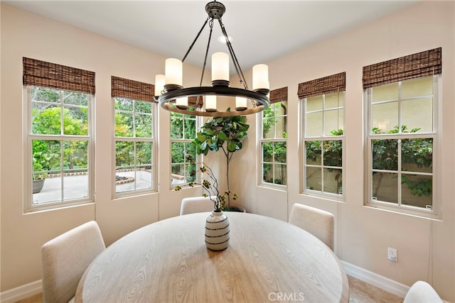 21 Corte Lomas Verdes, San Clemente, CA 92673 - dining space featuring a chandelier and baseboards