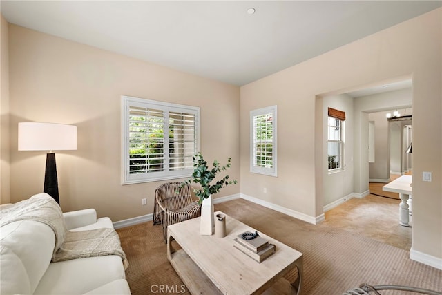 21 Corte Lomas Verdes, San Clemente, CA 92673 - living area with carpet, healthy amount of natural light, and baseboards