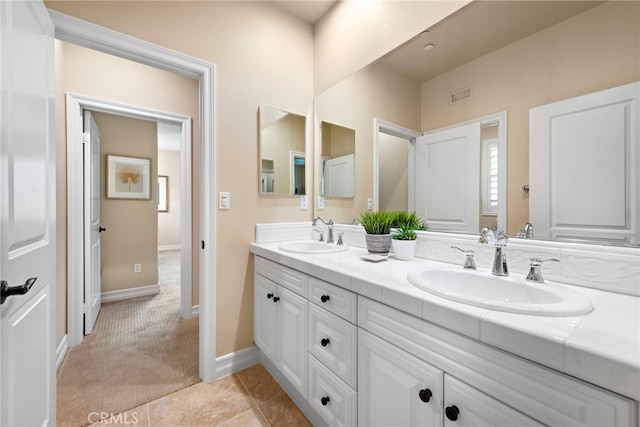 21 Corte Lomas Verdes, San Clemente, CA 92673 - bathroom featuring double vanity, baseboards, and tile patterned floors