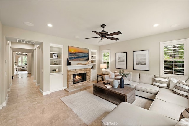 21 Corte Lomas Verdes, San Clemente, CA 92673 - living area with built in shelves, baseboards, plenty of natural light, a fireplace, and recessed lighting