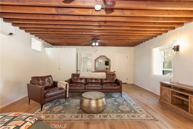 1615 Halsey St, Redlands, CA 92373 - living area featuring light wood finished floors, a ceiling fan, and a wall mounted air conditioner