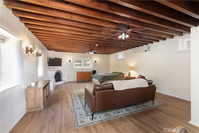 1615 Halsey St, Redlands, CA 92373 - living area with a fireplace, ceiling fan, wood finished floors, beamed ceiling, and a wall mounted air conditioner
